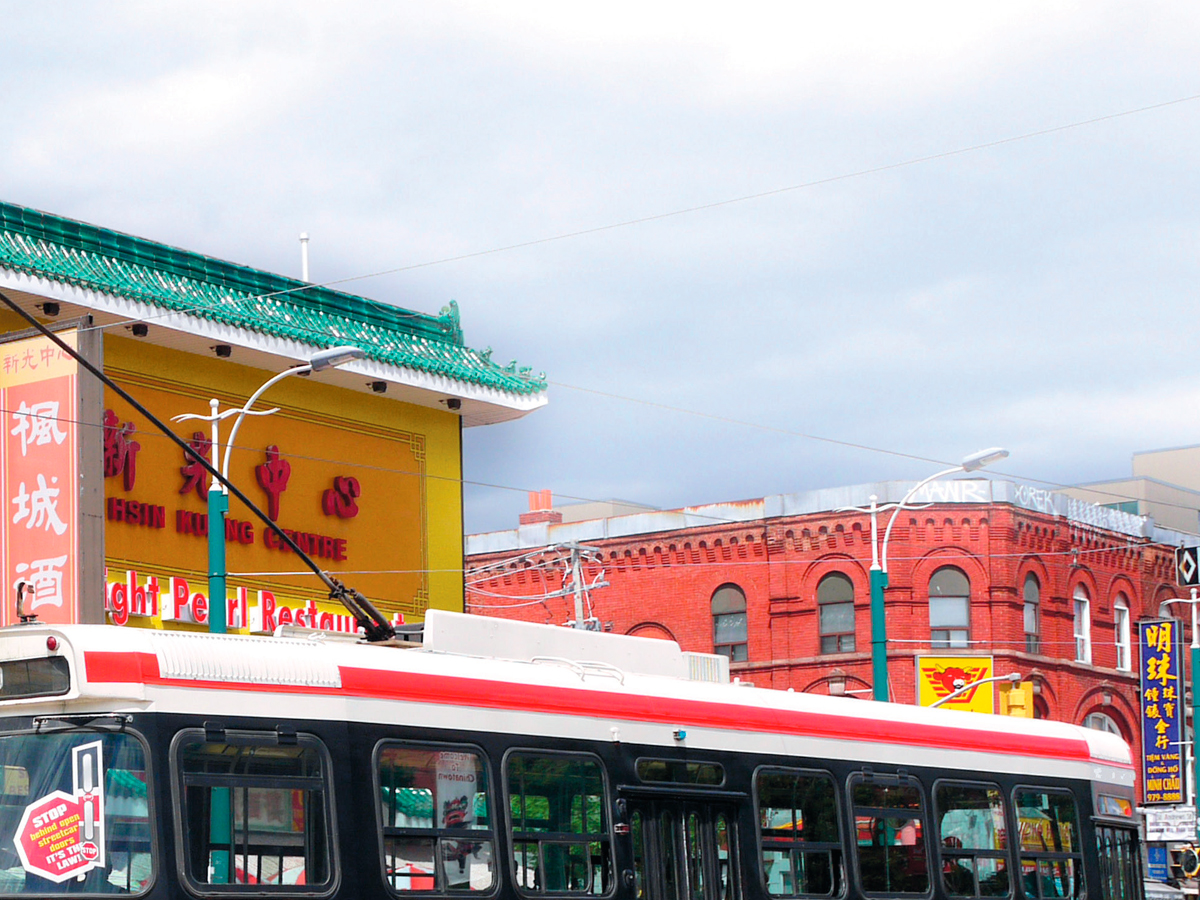 A TTC streetcar travelling through Chinatown in downtown Toronto