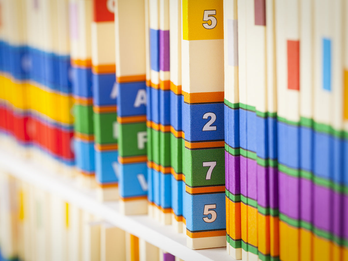 A shelf of colourful, numbered books