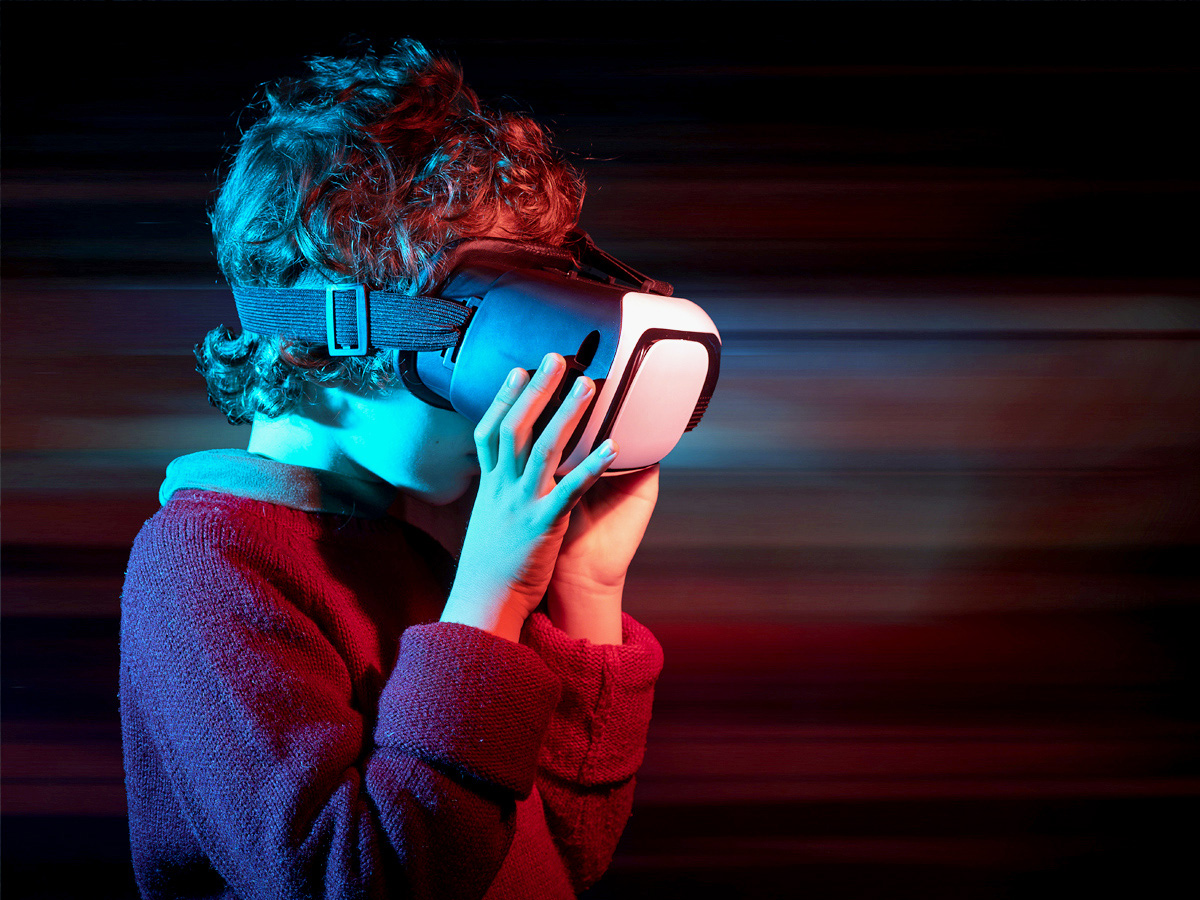 A child uses a virtual reality headset.
