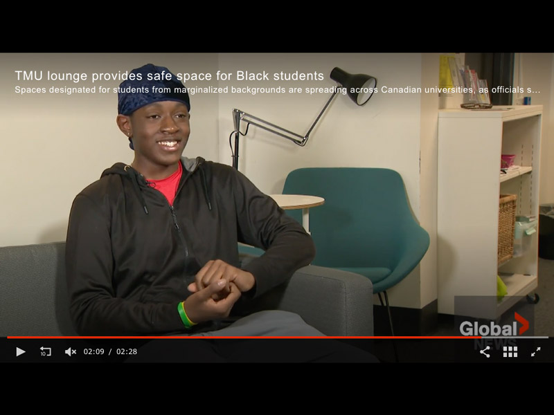 Joshua Baison, a Black TMU student, smiles while talking about the Black Student Lounge in an interview with Global News.