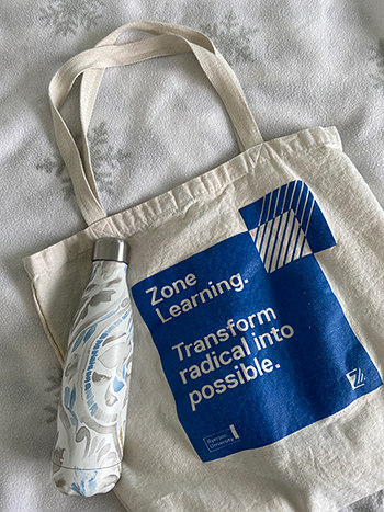 A Zone Learning tote bag and a reusable water bottle.