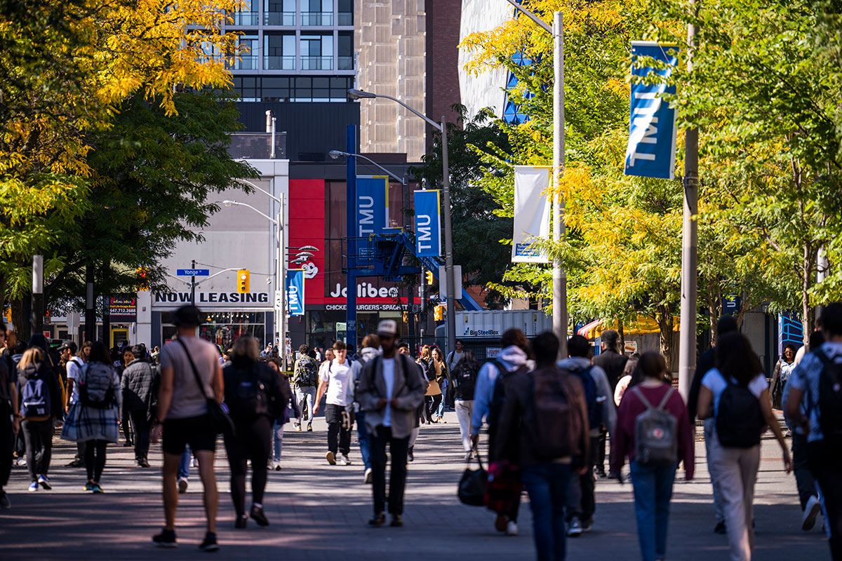 Students walking through the streets at the TMU campus