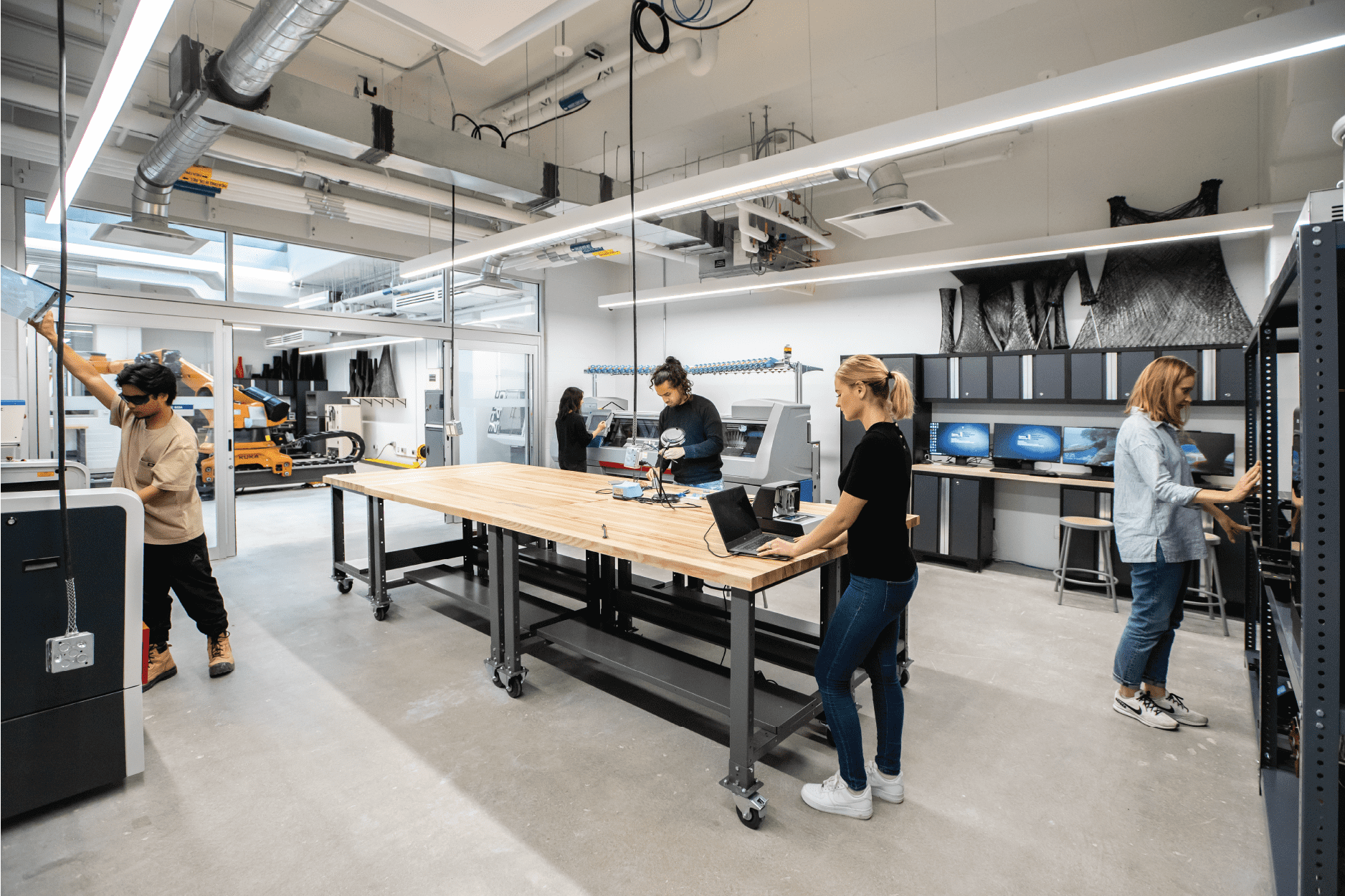 Photo of students working at desks and workbenches in the Design and Technology Lab