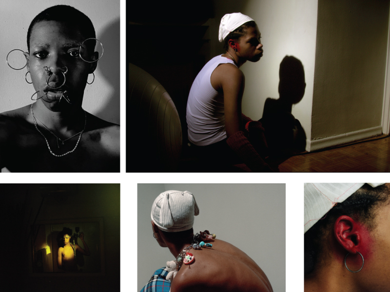 Five different self-portraits of Squires-Rouse. On the top left, he is seen with different large hoop earrings on his ears and face in black and white. To the right, Squires-Rouse sits on the floor wearing a white tank top with a white hat, his ear is painted red. Bottom right is a close-up image of his ear painted red with a hoop earring. The bottom middle shot shows him facing away from the camera, shirtless, with a charm necklace on and a white hat. The final portrait on the bottom left shows him in the mirror, holding his camera up on the right, under amber light. 