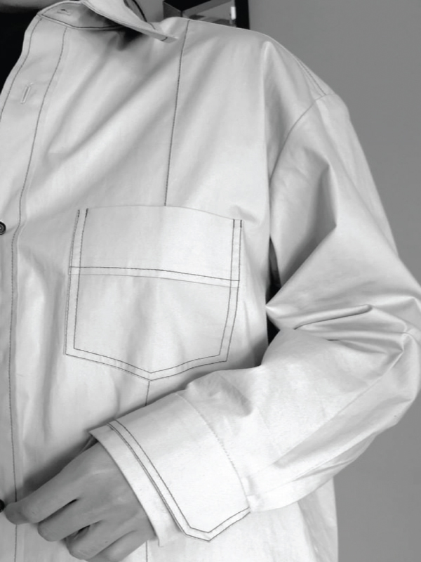 A close up of a white shirt breast pocket