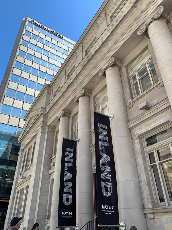 An exterior of a building with signs on each side with "INLAND" written on them.