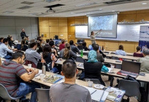 students listening to a lecture in a lecture hall