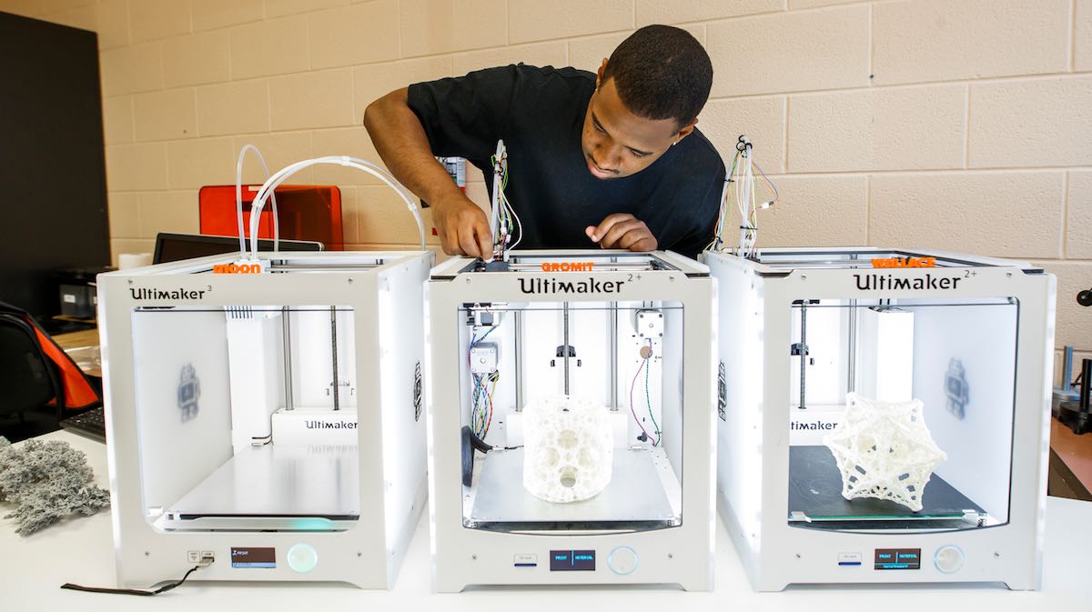 A student using 3D printers